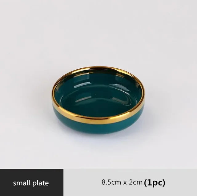 Green ceramic dinnerware set by MC THE BLACK DIAMOND, includes plates, bowls, and mugs for family dining.