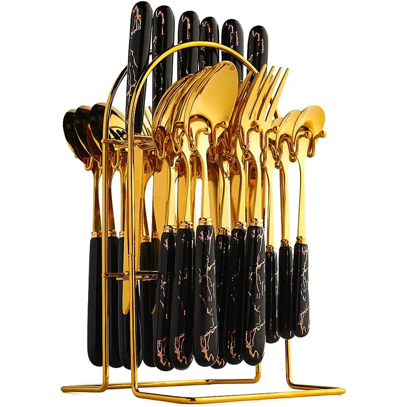 Set of stainless steel flatware including knives, forks, and spoons by MC THE BLACK DIAMOND, arranged neatly on a table.