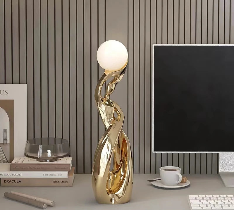 Large luminous sculpture for living room by MC THE BLACK DIAMOND, modern art statue with glowing features in a contemporary setting.