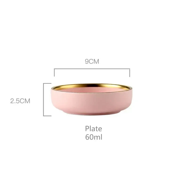 Set of MC THE BLACK DIAMOND ceramic kitchen dinnerware sets with plates, bowls, and mugs arranged on a table.