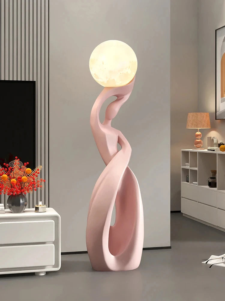 Large luminous living room sculpture by MC THE BLACK DIAMOND, modern art piece with glowing features in a stylish interior setting.