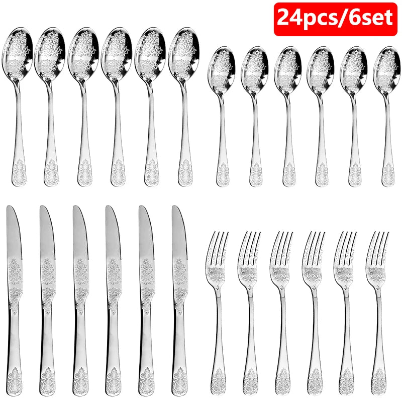 Stainless steel gold flatware set by MC THE BLACK DIAMOND, includes forks, knives, and spoons arranged on a white surface.