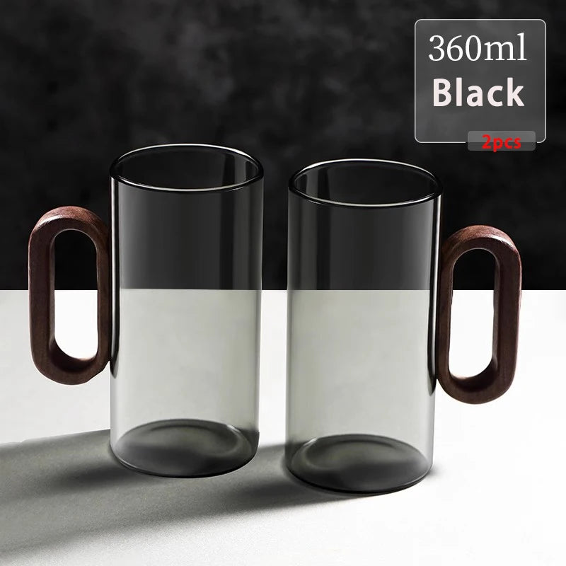 Glass mug with wooden handle from MC THE BLACK DIAMOND drinkware set, showcasing a clear glass with a stylish wooden handle.
