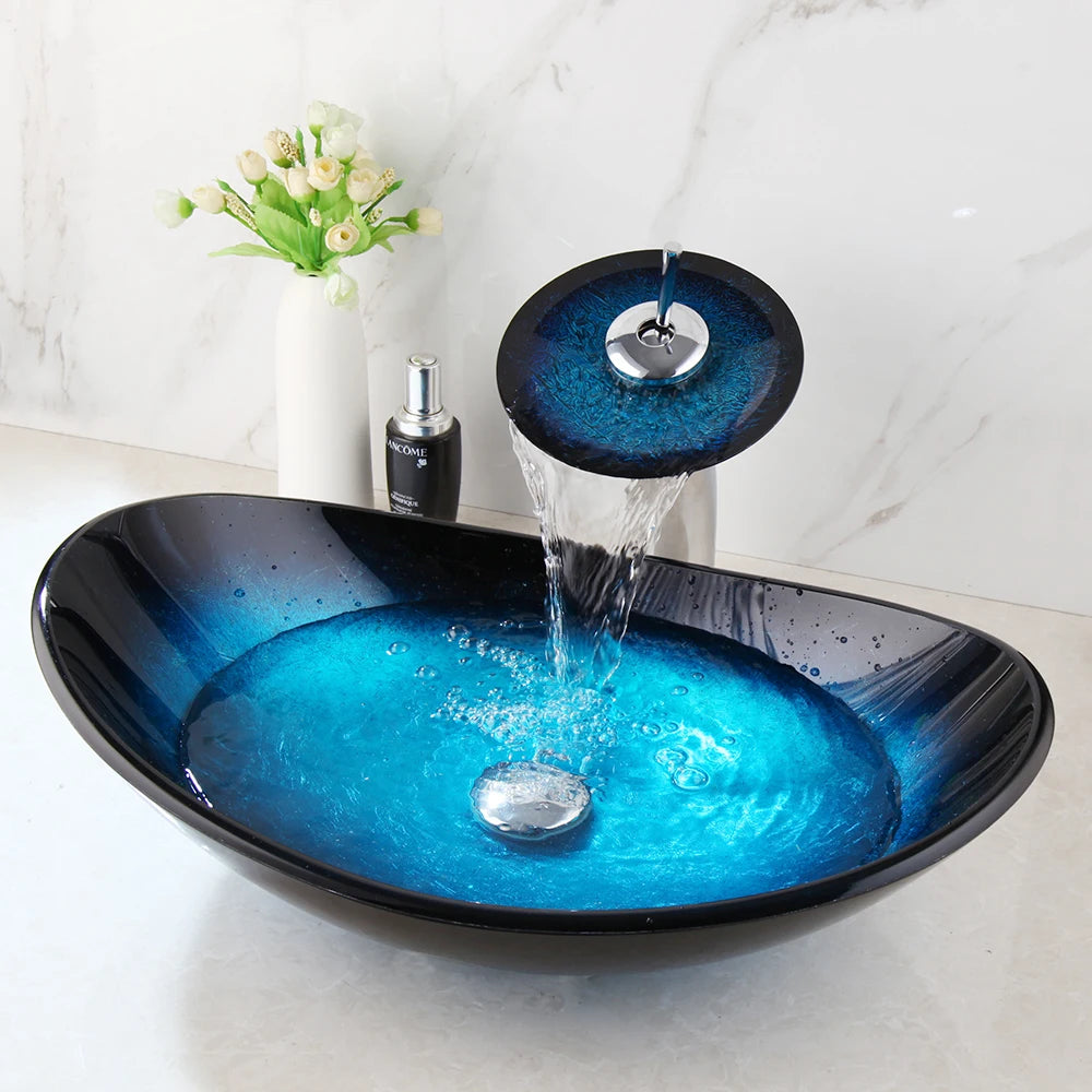 Blue glass vessel sink with waterfall faucet set by MC THE BLACK DIAMOND, showcasing a modern bathroom vanity fixture