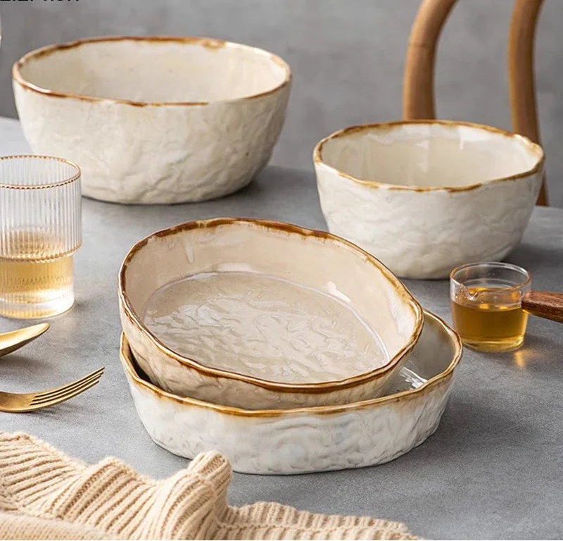 Set of ceramic deep thick dinnerware from MC THE BLACK DIAMOND, including plates and bowls arranged on a table.