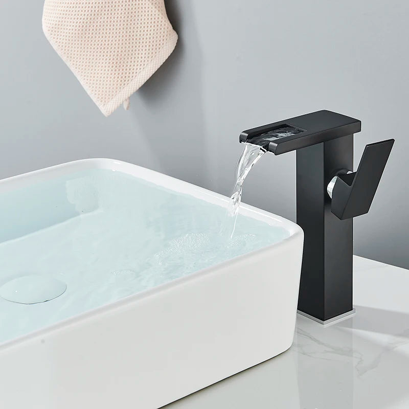 LED temperature-display basin faucet for bath sink by MC THE BLACK DIAMOND, showing the sleek, modern design with illuminated temperature indicator.