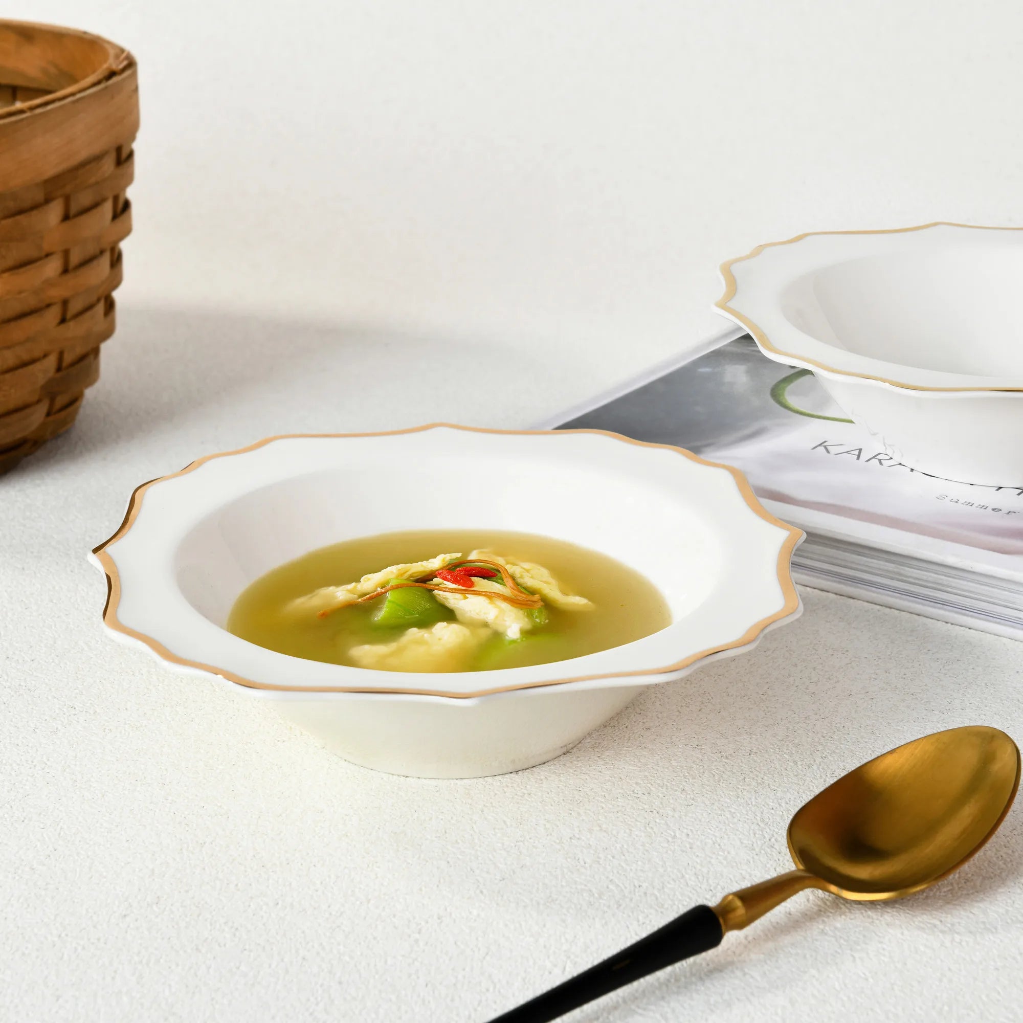 Elegant porcelain dinnerware set by MC THE BLACK DIAMOND, featuring matching plates and bowls for luxury table setting.