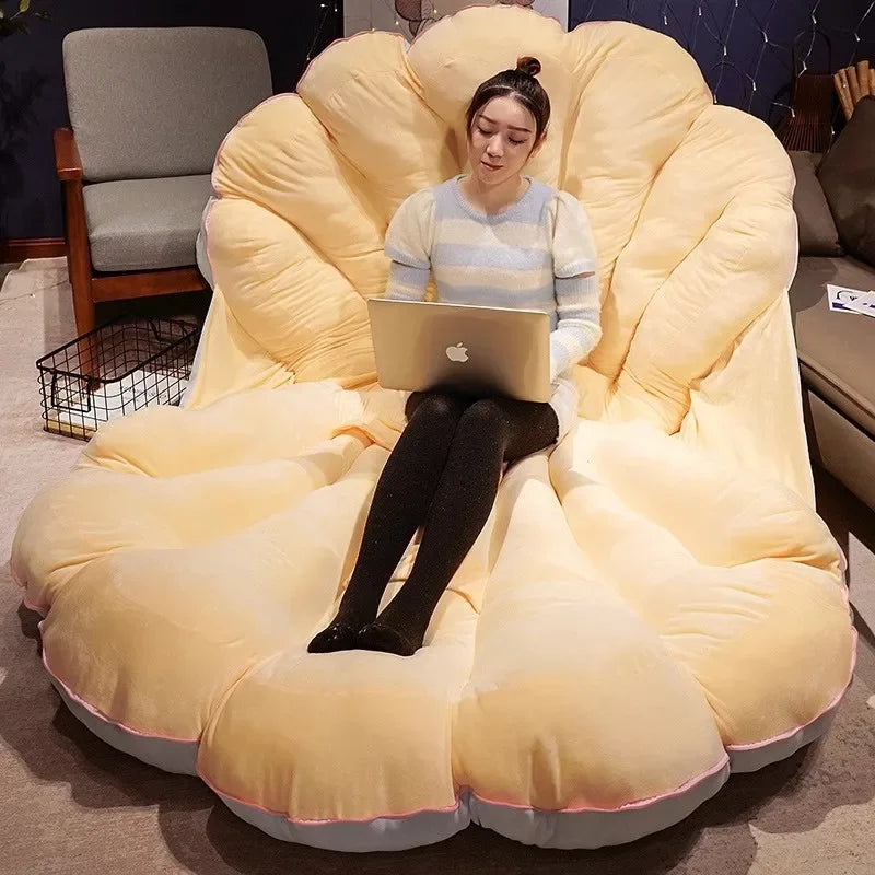 Large clamshell-shaped plush cushion from MC THE BLACK DIAMOND, designed as a seashell sofa pillow for kid beds.