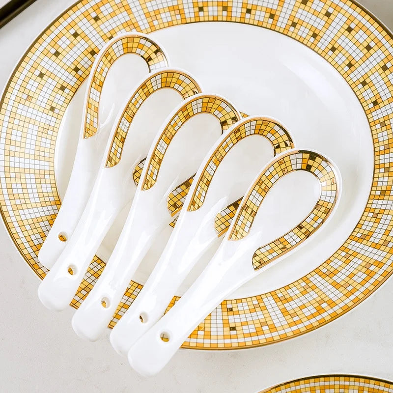 Elegant MC THE BLACK DIAMOND light luxury style tableware set with dinner plates, bowls, and cups arranged on a dining table.