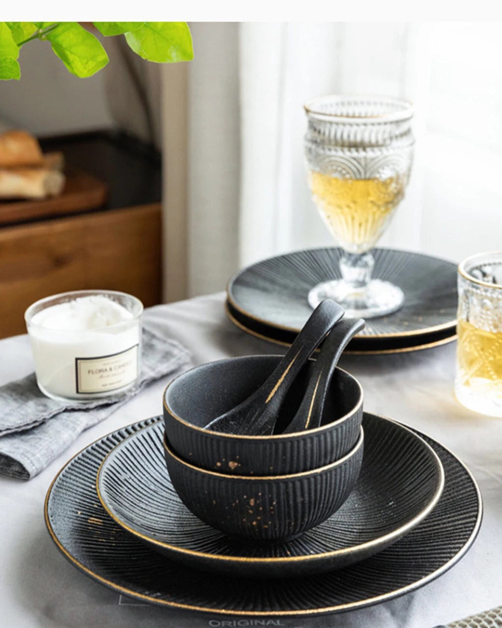 Luxury golden and black dinnerware set by MC THE BLACK DIAMOND, featuring elegant plates and bowls for sophisticated table settings.