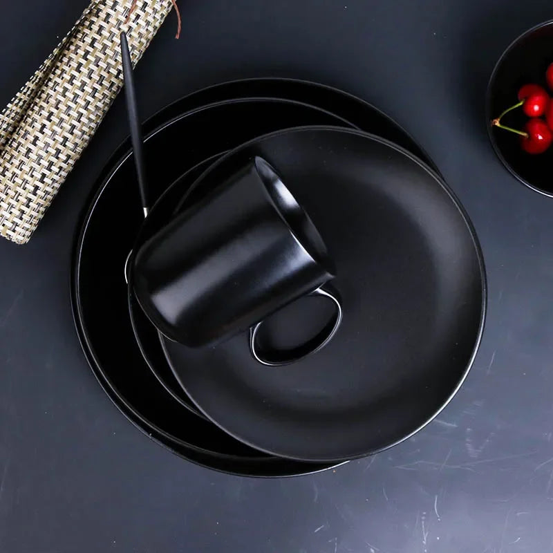 Deep black family dinner set by MC THE BLACK DIAMOND, featuring elegant dinnerware pieces for family meals.