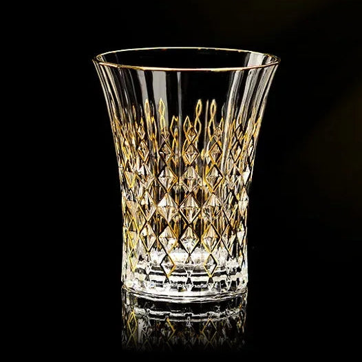 Elegant glass gold crystal red cup from MC THE BLACK DIAMOND drinkware set, showcasing a shiny gold finish and vibrant red design.