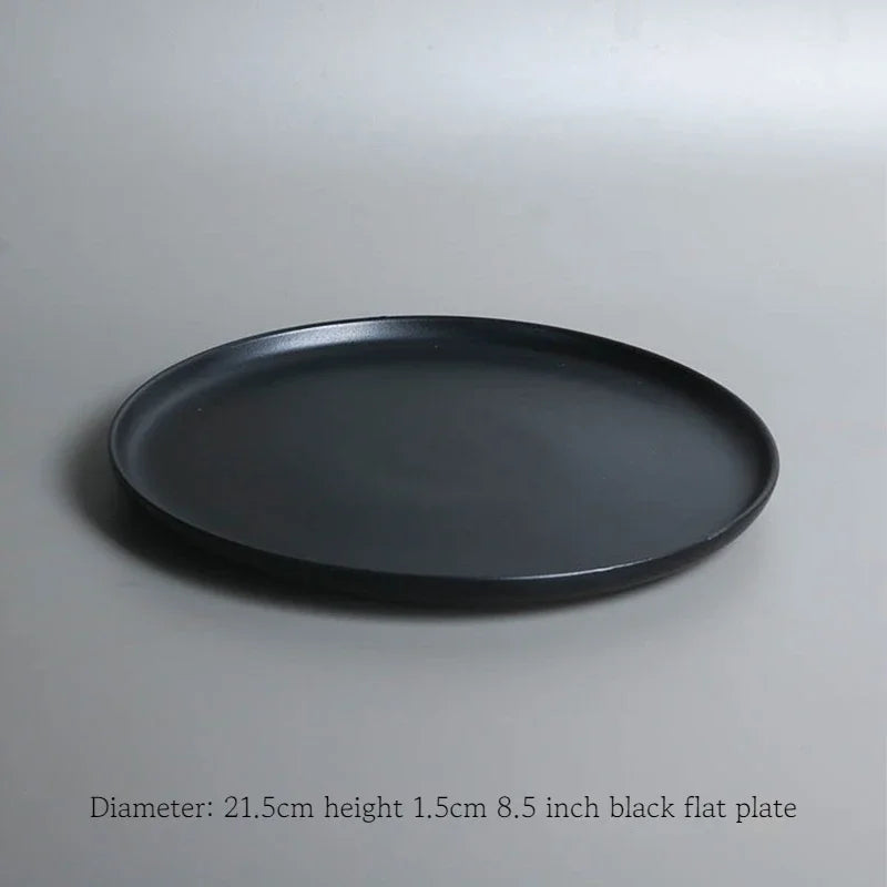 Deep black family dinner set by MC The Black Diamond, featuring matching plates and bowls for elegant dining.