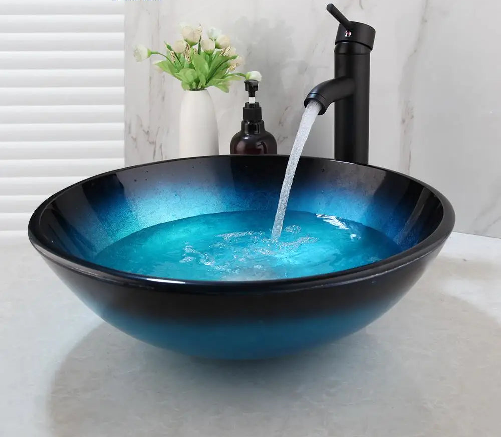 Blue glass vessel sink and waterfall faucet set by MC THE BLACK DIAMOND, modern bathroom vanity fixture with sleek design.