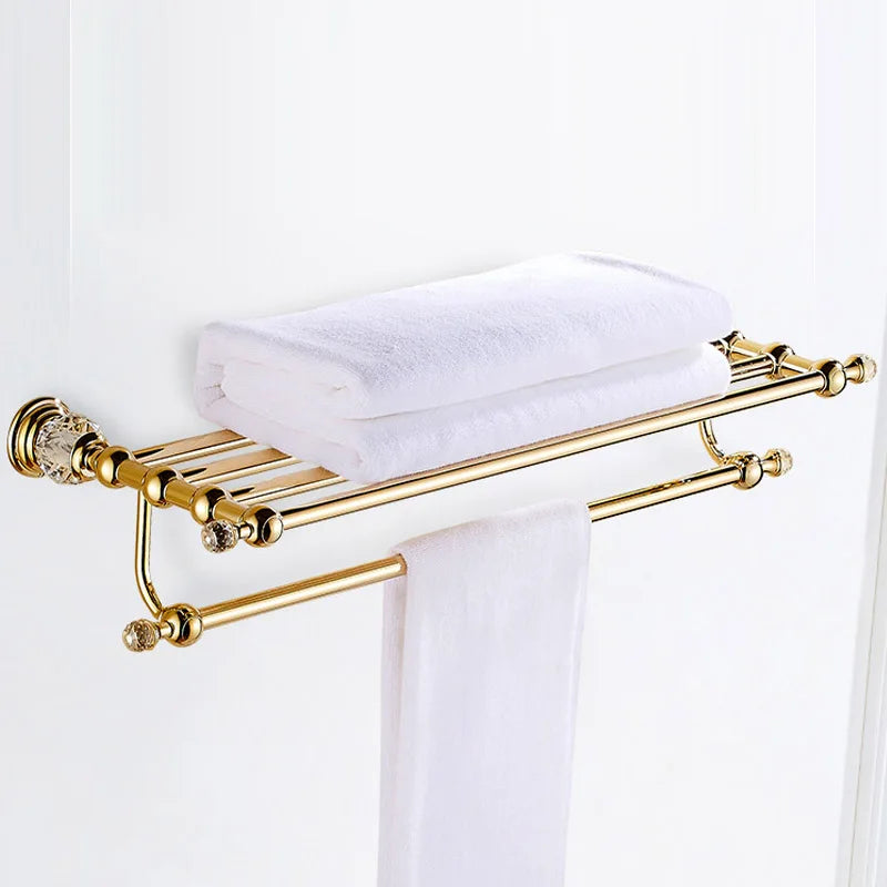 Luxury gold polished brass bathroom accessories set by MC THE BLACK DIAMOND, includes soap dispenser, toothbrush holder, and tumbler.