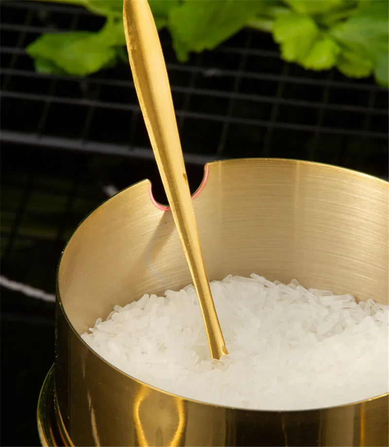 MC THE BLACK DIAMOND golden seasoning box with glass cap, spoon, and flavoring tank for kitchen use.
