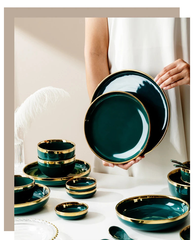 Dark green ceramic cutlery bowls set with gold-plated accents, including rice bowls and porcelain plates for kitchen and dining use.