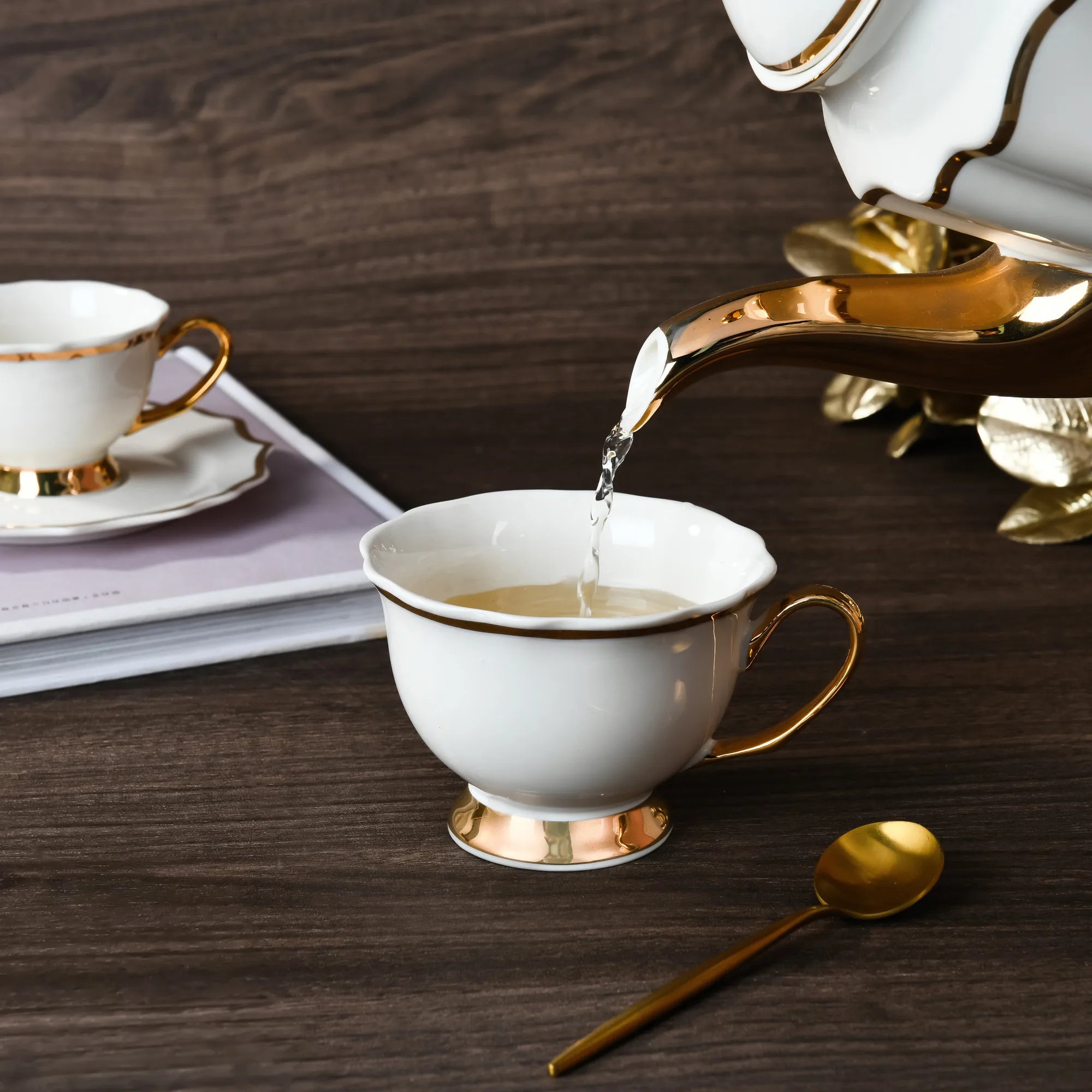Luxury porcelain dinnerware set by MC THE BLACK DIAMOND, includes plates and bowls for elegant table setting.