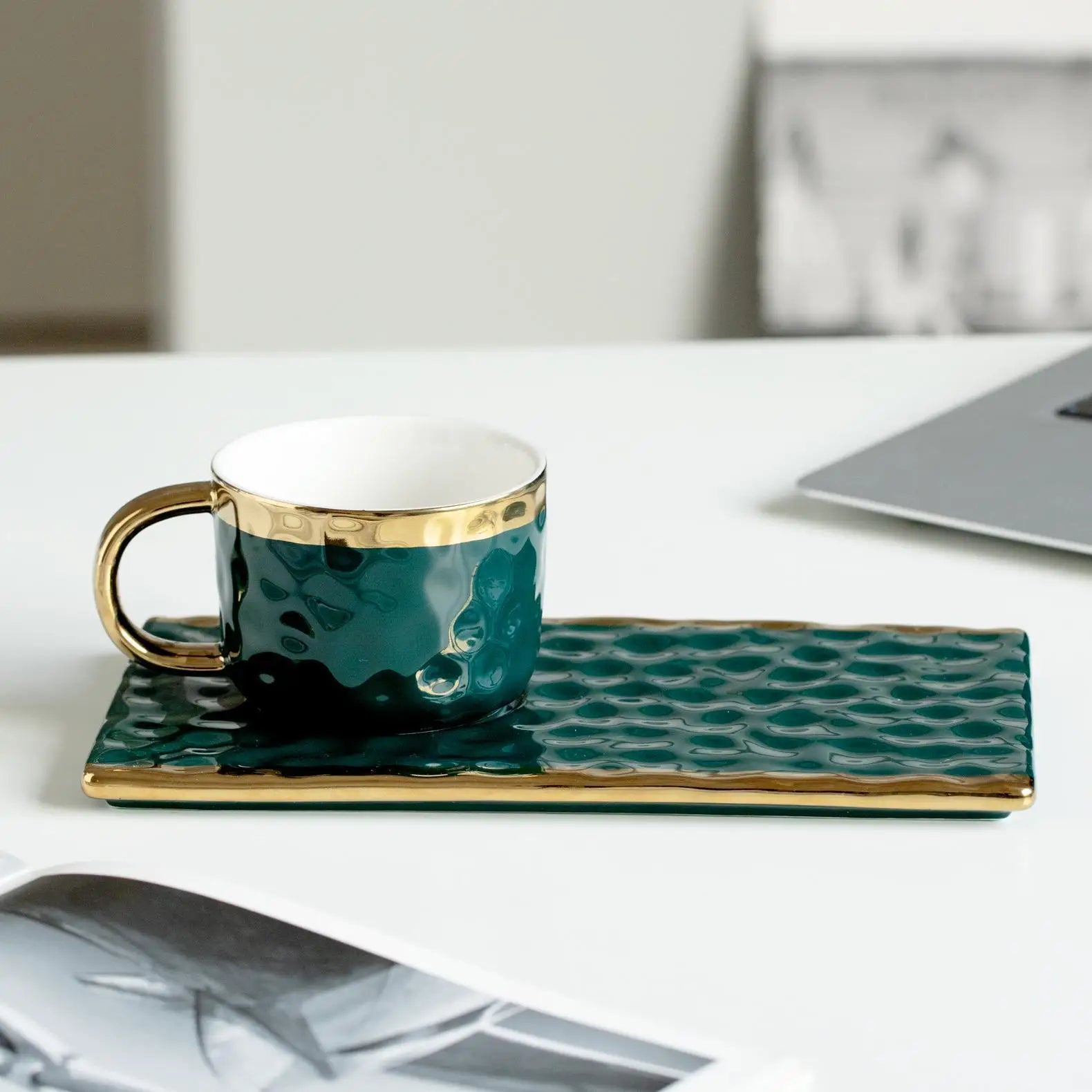 Set of MC THE BLACK DIAMOND coffee and tea cups, milk mugs, and afternoon tea cups arranged together on a table.