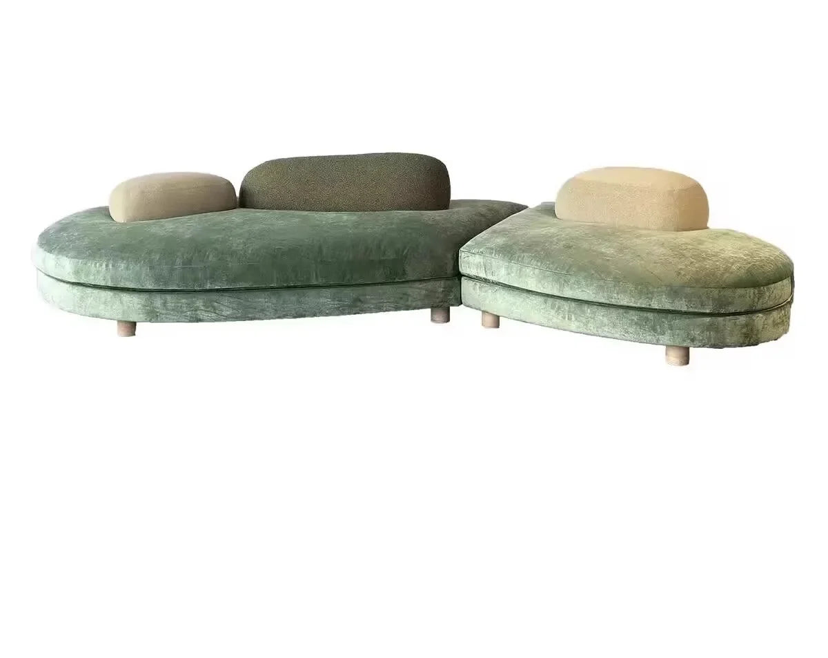Large green fabric sectional sofa by MC THE BLACK DIAMOND, featuring a flat layered design with special-shaped sections.