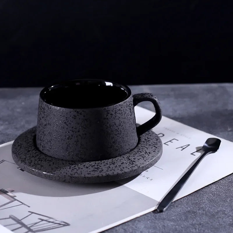 Black ceramic coffee cup and saucer set with spoon and cup holder from MC THE BLACK DIAMOND, ideal for breakfast coffee or tea.