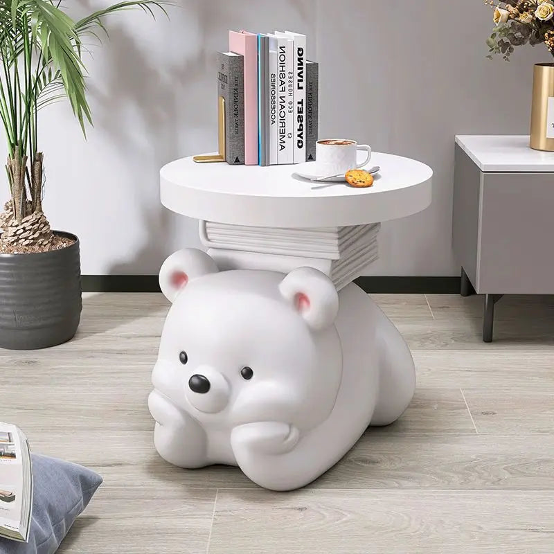 Cream bear-shaped MC THE BLACK DIAMOND end table used as a living room floor ornament and home accessory.