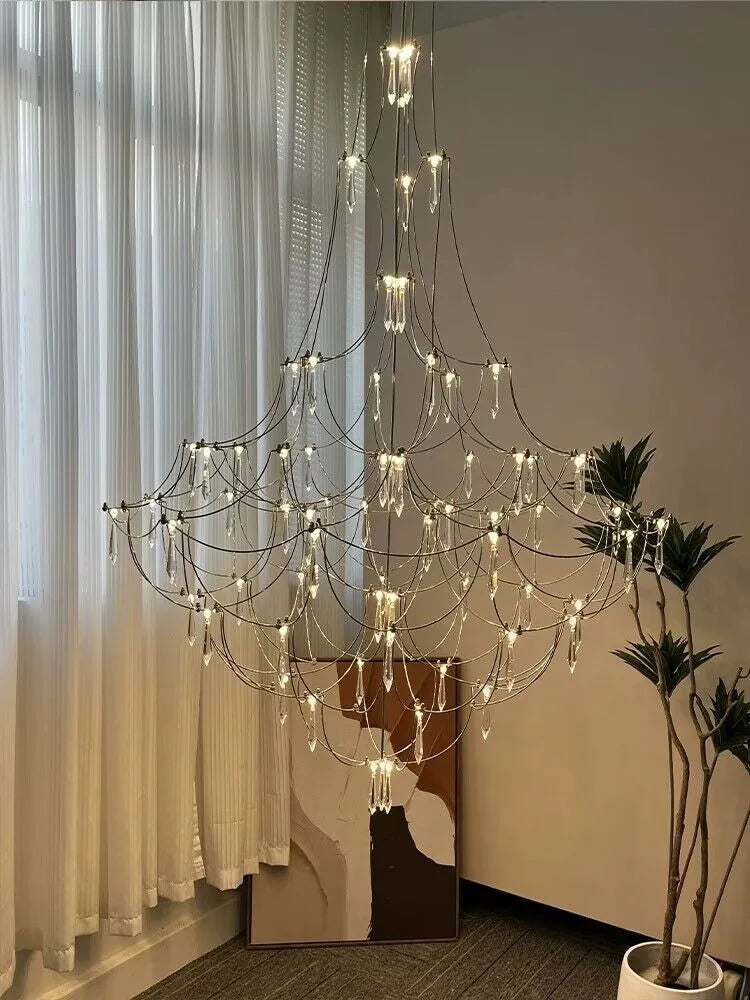 Deluxe Crystal Star Lamp chandelier by MC THE BLACK DIAMOND featuring clear crystal star-shaped lighting fixtures.