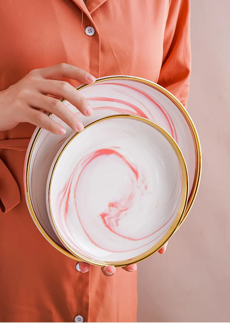 Pink gilded marble pattern porcelain dinnerware set by MC THE BLACK DIAMOND, featuring elegant plates and bowls on a white background.