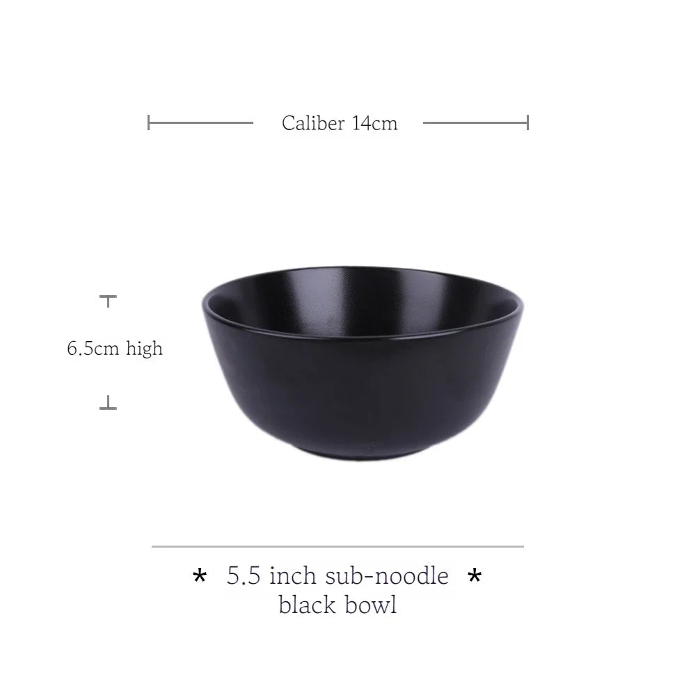Deep black family dinner set by MC The Black Diamond featuring plates, bowls, and cups arranged on a dining table.