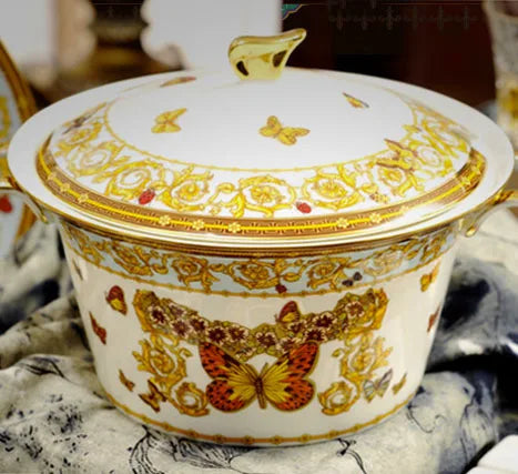 Golden butterfly dinnerware set by MC THE BLACK DIAMOND featuring elegant, decorative tableware pieces with butterfly motifs.