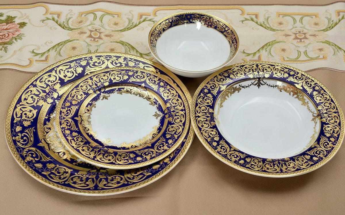 Royal Style embossed gold rim ceramic dinner set by MC THE BLACK DIAMOND, featuring elegant plates and bowls with gold accents.