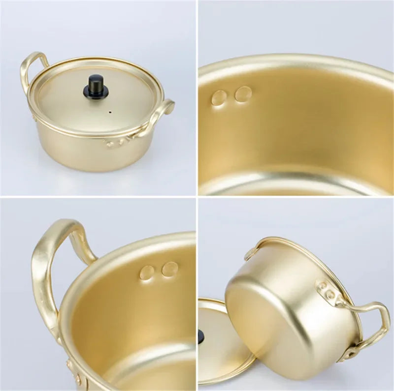 Gold aluminum stock pot from MC THE BLACK DIAMOND, ideal for hot cooking and kitchen use, with a shiny finish and sturdy handle.