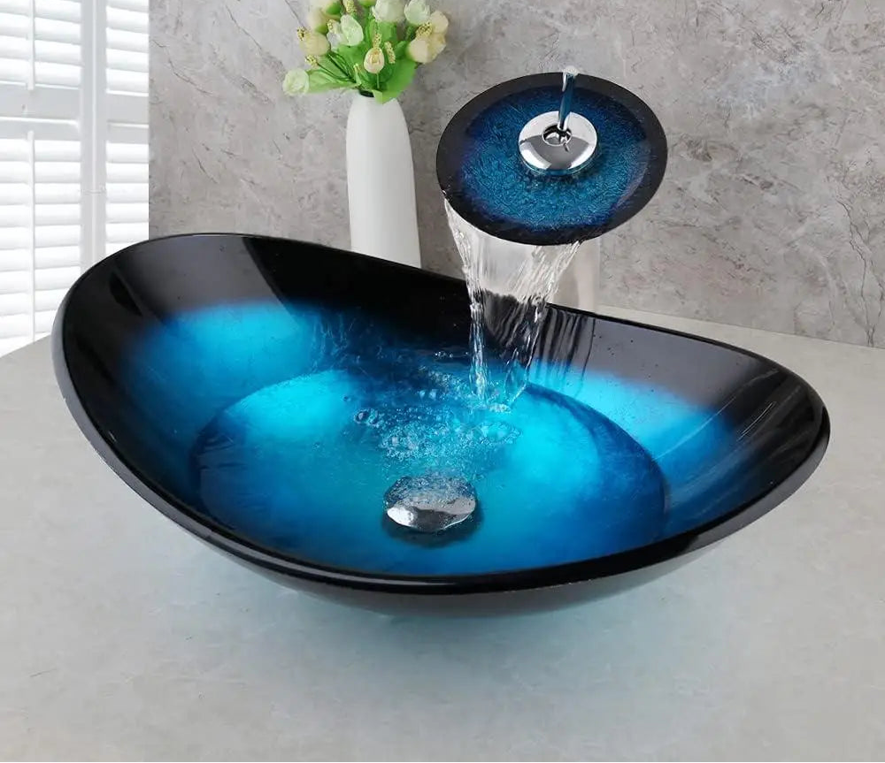 Blue glass vessel sink with waterfall faucet set from MC THE BLACK DIAMOND, featuring a sleek, modern design and smooth water flow.