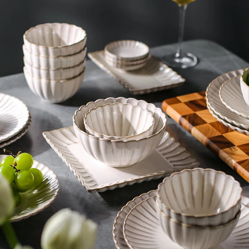 White chrysanthemum-shaped ceramic dinnerware set by MC THE BLACK DIAMOND, featuring elegant floral design for dining occasions.