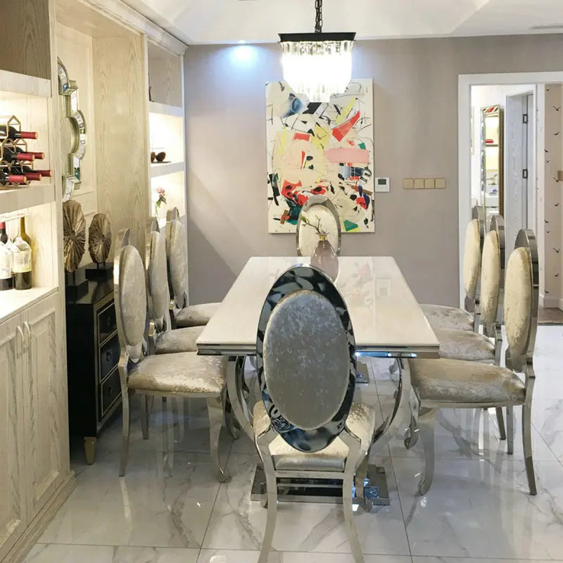 Light luxury style dining table set by MC THE BLACK DIAMOND, featuring elegant wooden table and matching chairs for sophisticated home decor.