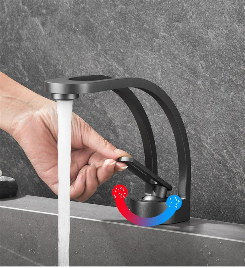 Single-handle MC THE BLACK DIAMOND bathroom basin faucet with sleek modern design, mounted on a bathroom sink.