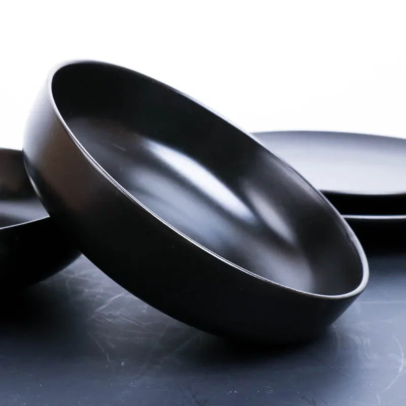 Deep black family dinner set by MC The Black Diamond, featuring matching plates, bowls, and mugs for stylish dining.