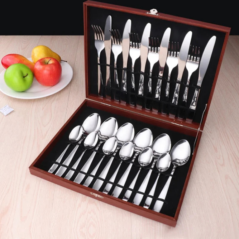 MC THE BLACK DIAMOND golden flatware set with cutlery dishes, featuring elegant utensils for dining and serving.