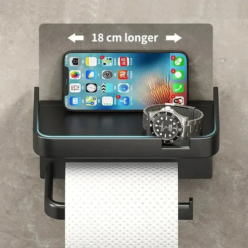 Plastic toilet paper holder by MC THE BLACK DIAMOND, mounted on a wall for convenient bathroom storage.