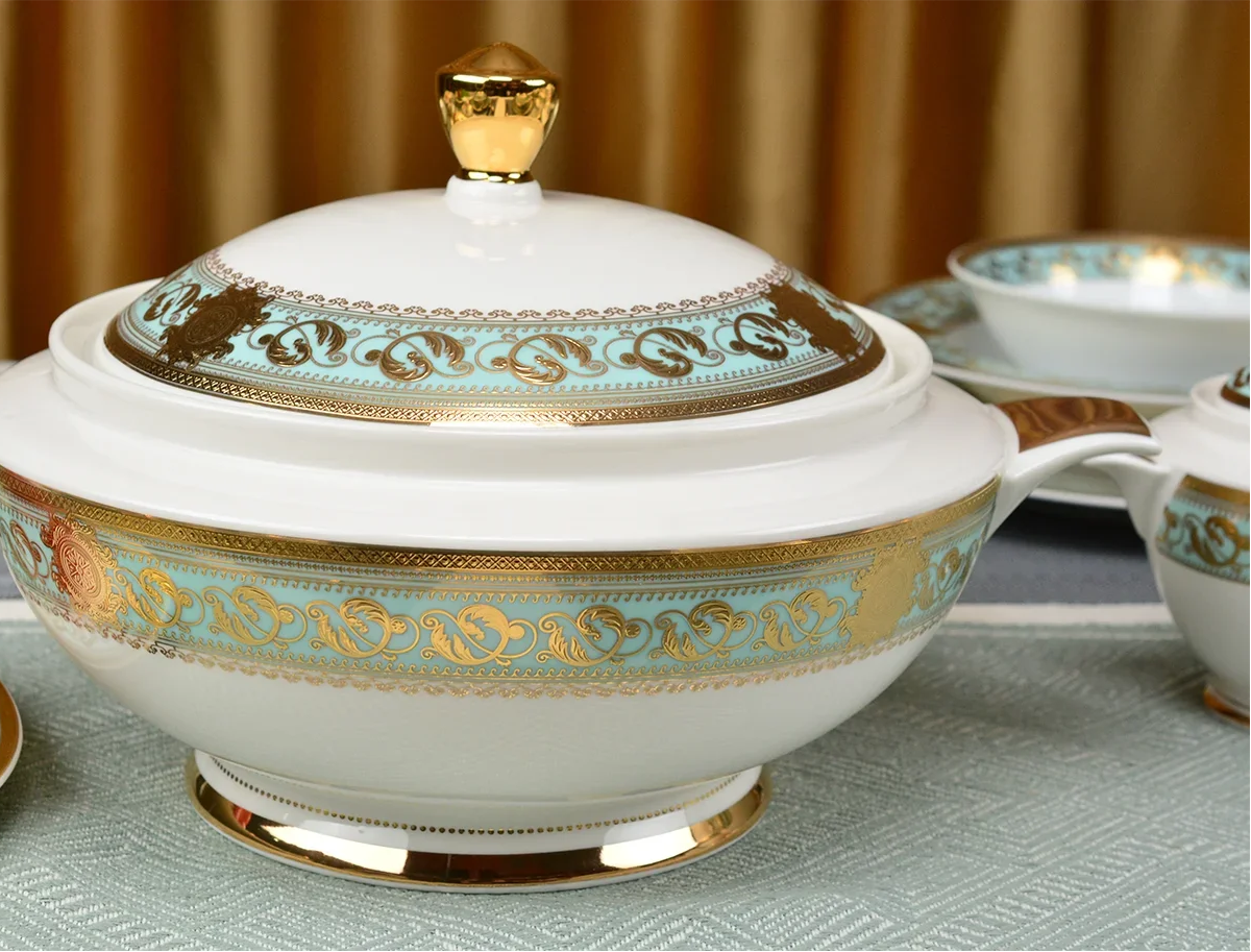 Embossed gold porcelain dinnerware set with elegant patterns, luxury MC THE BLACK DIAMOND brand for sophisticated table setting.