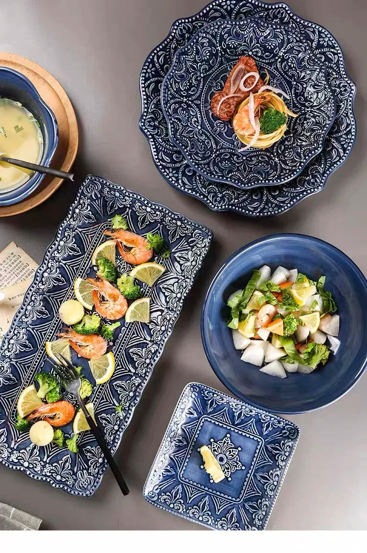 Blue retro relief ceramic dinnerware set with matching plates and bowls from MC THE BLACK DIAMOND, showcasing vintage-inspired relief designs.