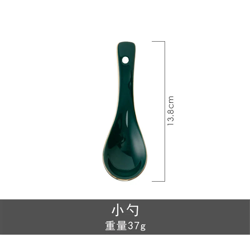 Dark green ceramic cutlery bowls set with gold-plated accents, featuring rice bowls and porcelain dishes for kitchen use.
