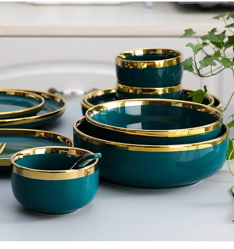Green ceramic dinnerware set by MC THE BLACK DIAMOND, featuring plates and bowls for family dining.