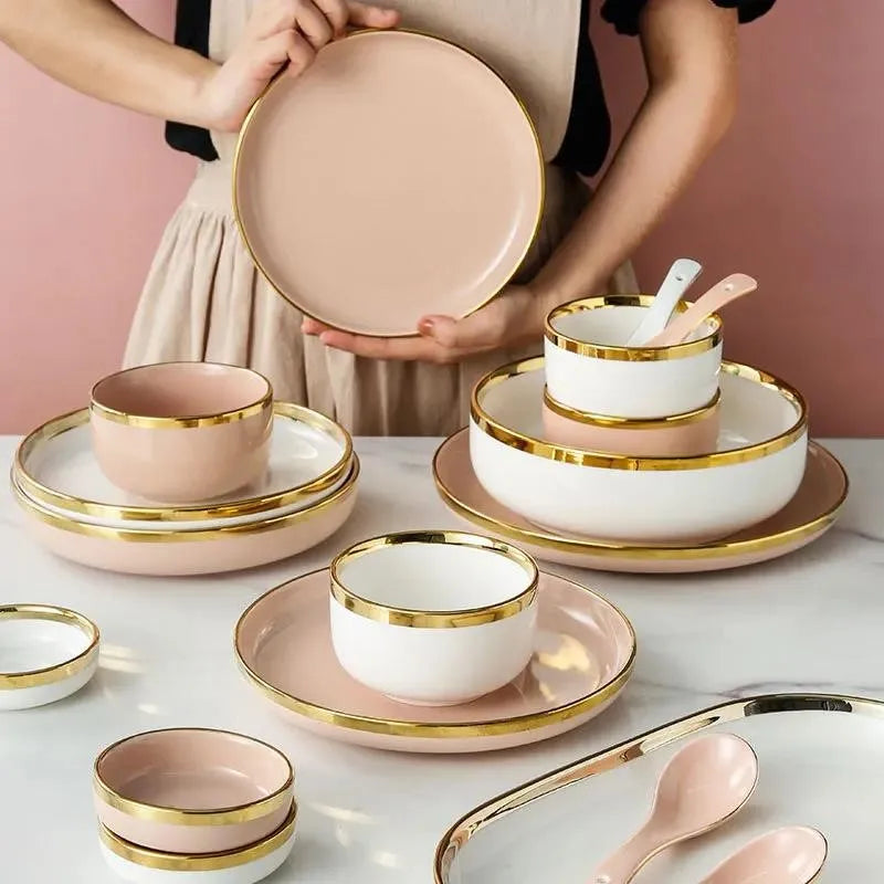 Set of bright white and pink porcelain plates with gold accents from MC THE BLACK DIAMOND, perfect for elegant kitchen table settings.