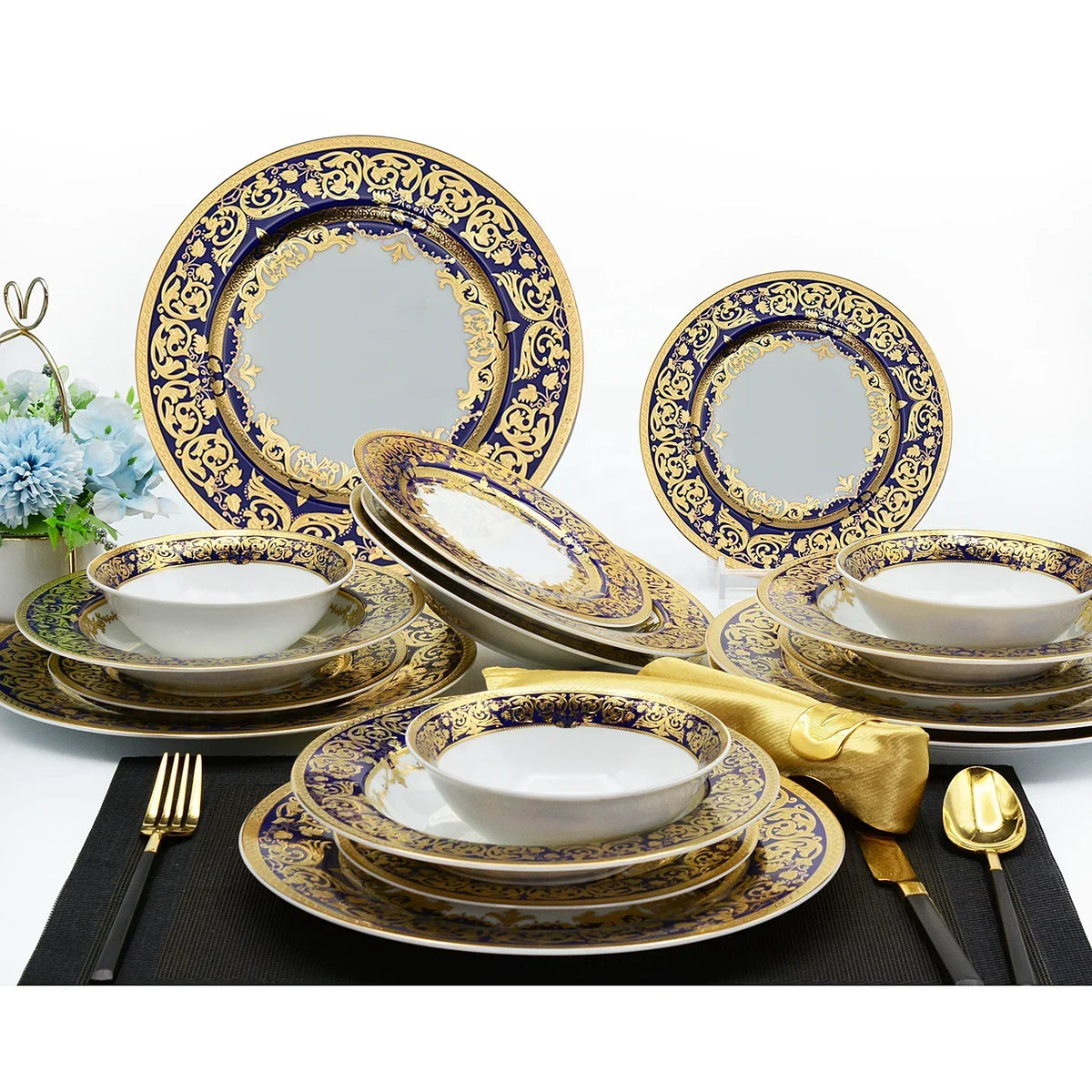 Royal Style embossed gold rim ceramic dinner set by MC THE BLACK DIAMOND, featuring elegant plates and bowls with intricate gold detailing.