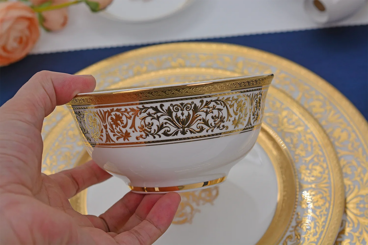 MC THE BLACK DIAMOND Royal dinnerware family set with plates, bowls, and cups arranged on a table for a formal meal.