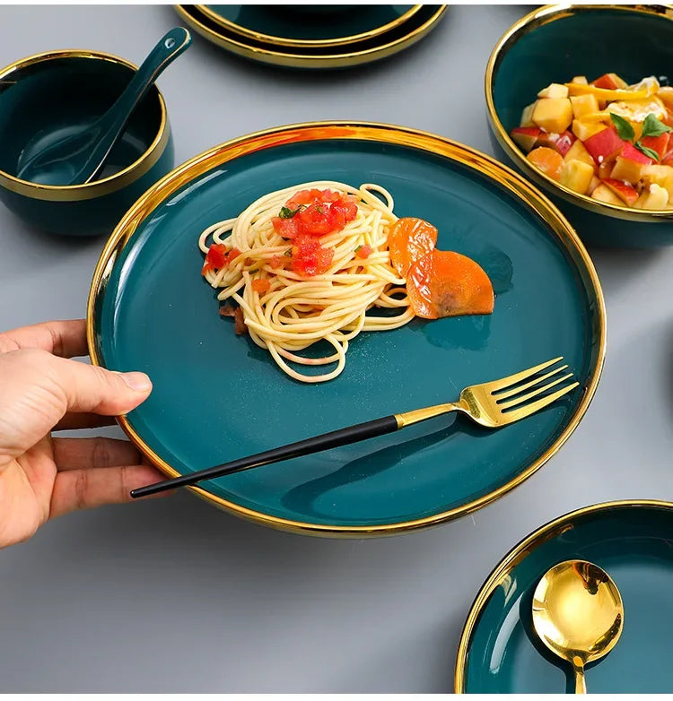 Green ceramic dinnerware set by MC THE BLACK DIAMOND, includes plates and bowls with a sleek, modern design for family dining.