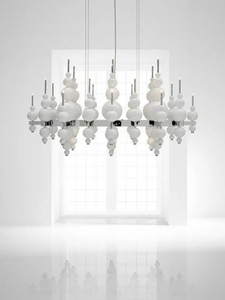 Black chandelier from MC THE BLACK DIAMOND, luxury living room lighting fixture with elegant design and multiple light bulbs.